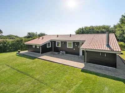 a house with a large yard in front of it at Holiday Home Kai - 500m to the fjord by Interhome in Struer