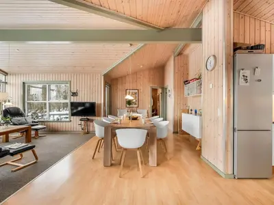 a kitchen and dining room with a table and chairs at Holiday Home Kai - 500m to the fjord by Interhome in Struer