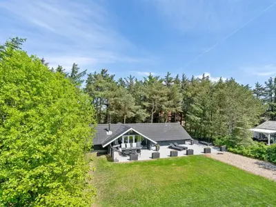 an exterior view of a house with a yard at Holiday Home Hjalmara - 900m from the sea by Interhome in Thisted
