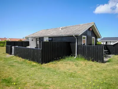 a black fence in front of a house at Holiday Home Engelbertine - 900m from the sea by Interhome in Thisted