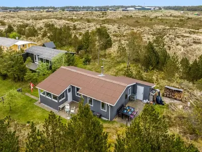 an aerial view of a house in a field at Holiday Home Gundina - 2km from the sea by Interhome in Thisted
