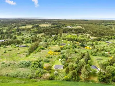 an aerial view of a farm with houses and trees at Holiday Home Aameek - 3km from the sea by Interhome in Frøstrup