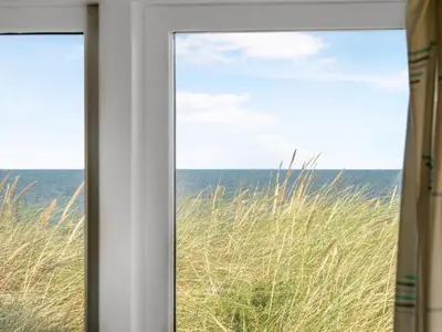 a window view of the ocean from a beach at Holiday Home Ebba - 25m from the sea by Interhome in Frøstrup