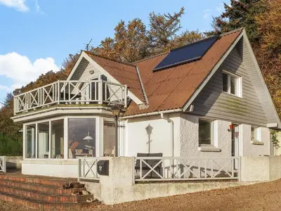 a house with a roof with a solar panel on it at Holiday Home Simo - 250m from the sea by Interhome in Øsløs