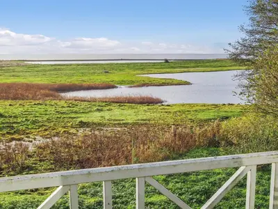 a view of a river from a fence at Holiday Home Simo - 250m from the sea by Interhome in Øsløs