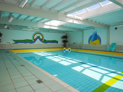 a large swimming pool with a rainbow on the wall at Apartment Ingeborre - 100m to the fjord by Interhome in Vestervig