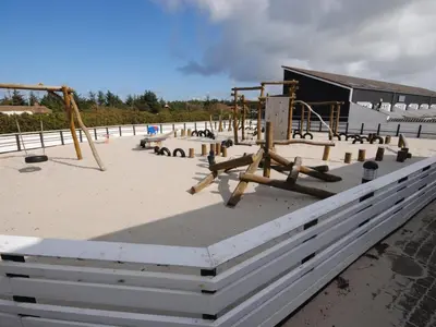 a park with a playground with swings at Apartment Hubertine - 100m to the fjord by Interhome in Vestervig