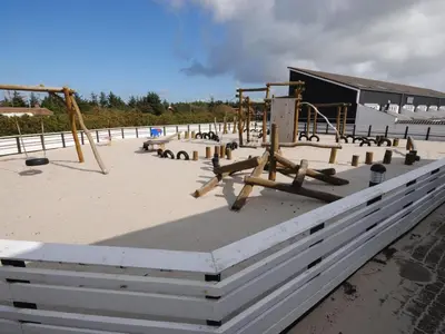 a park with a playground with swings at Apartment Stelle - 100m to the fjord by Interhome in Vestervig
