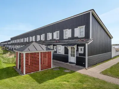 an overhead view of a black building with a row of houses at Apartment Siunde - 100m to the fjord by Interhome in Vestervig