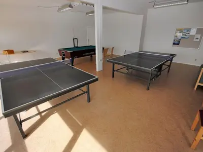 two ping pong tables in a room with a ping pong ball at Apartment Benta - 150m to the fjord by Interhome in Vestervig