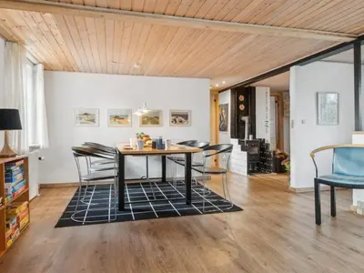 a dining room with a table and chairs at Holiday Home Gertina - 40m to the fjord by Interhome in Vestervig
