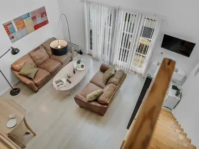 a living room with two couches and a table at Apartment Eleen - 100m to the fjord by Interhome in Vestervig