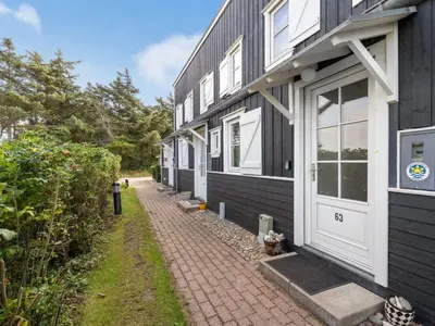 a row of houses on a brick sidewalk at Apartment Cita - 100m to the fjord by Interhome in Vestervig