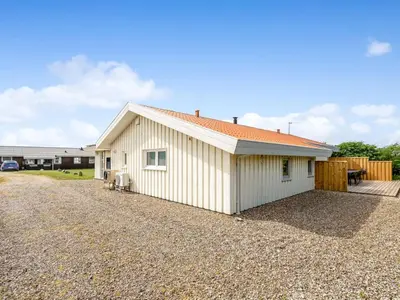 a large white building with a gravel driveway at Holiday Home Sulevi - 200m to the fjord by Interhome in Vestervig