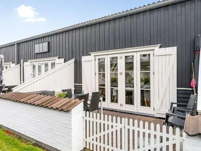 a house with a white fence in front of it at Apartment Hermanda - 100m to the fjord by Interhome in Vestervig