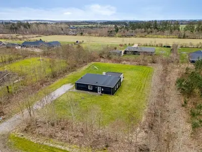 an overhead view of a black house in a field at Holiday Home Jarven - 500m to the fjord by Interhome in Højslev