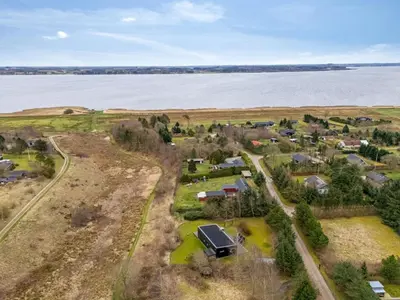 an aerial view of a village next to the water at Holiday Home Tenna - 250m to the fjord by Interhome in Højslev