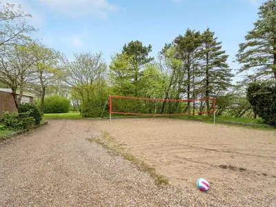 a soccer ball sitting on the ground next to a goal at Holiday Home Rahild - 2km to the fjord by Interhome in Thyholm