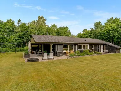 a house with a large lawn in front of it at Holiday Home Yorrit - 500m to the fjord by Interhome in Højslev