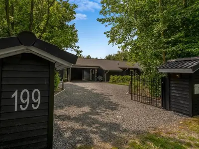 a house with a gate and a driveway at Holiday Home Yorrit - 500m to the fjord by Interhome in Højslev