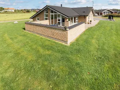 a house with a lawn in front of it at Holiday Home Alboldus - 250m to the fjord by Interhome in Vinderup