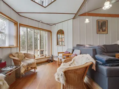 a living room with a couch and chairs at Holiday Home Flugha - 500m to the fjord by Interhome in Thyholm