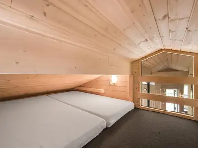 a small room with two beds and a window at Holiday Home Lucio - 350m to the fjord by Interhome in Vinderup