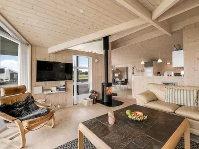 a living room with a couch and a table at Holiday Home Lucio - 350m to the fjord by Interhome in Vinderup