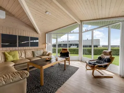 a living room with a couch and a table at Holiday Home Lucio - 350m to the fjord by Interhome in Vinderup