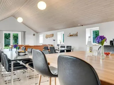a dining room with a table and chairs at Holiday Home Folkar - 3km to the fjord by Interhome in Thyholm