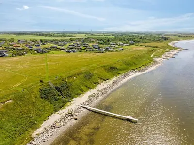 an aerial view of a beach with a group of houses at Holiday Home Samuil - 300m to the fjord by Interhome in Vinderup