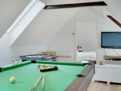 a living room with a pool table and a tv at Holiday Home Ailke - 2km to the fjord by Interhome in Thyholm