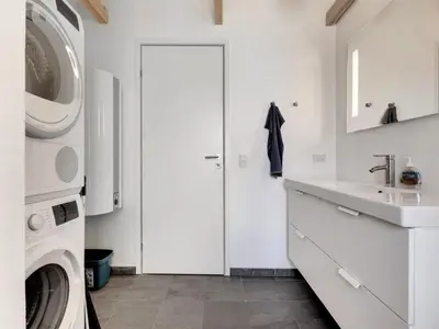 a white laundry room with a washing machine and a sink at Holiday Home Aslag - 150m to the fjord by Interhome in Vinderup
