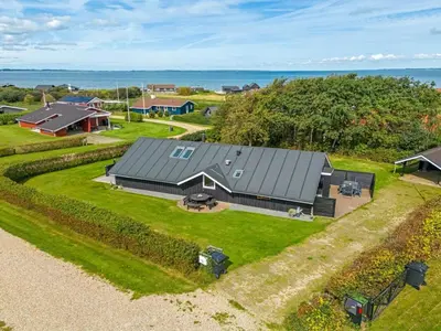 an aerial view of a house with a yard at Holiday Home Naninja - 300m to the inlet by Interhome in Vinderup