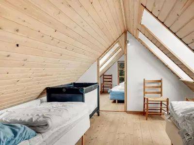 a room with two beds in a attic at Holiday Home Aliza - 300m to the fjord by Interhome in Roslev
