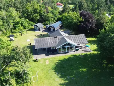 an aerial view of a house in the woods at Holiday Home Elis - 90m to the fjord by Interhome in Roslev