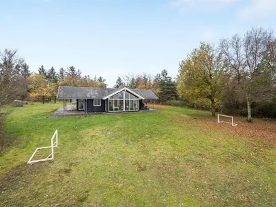 a house in a field with two goals at Holiday Home Elis - 90m to the fjord by Interhome in Roslev
