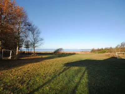 a field of grass with a soccer goal at Holiday Home Elis - 90m to the fjord by Interhome in Roslev