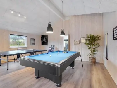 a billiard room with two ping pong tables at Holiday Home Sibbe - 500m to the fjord by Interhome in Spottrup