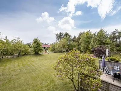 a view of a yard with a fence and a yard at Holiday Home Femija - 500m to the fjord by Interhome in Roslev