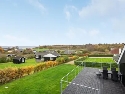 a view from the roof of a house with a deck at Holiday Home Clarita - 300m to the fjord by Interhome in Roslev