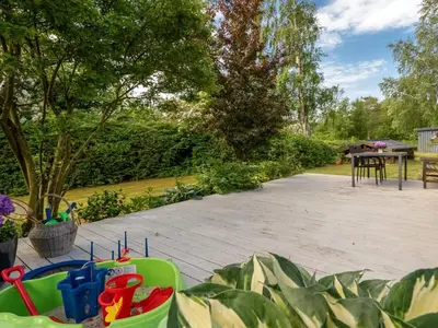 a patio with a table and a bunch of toys at Holiday Home Paale - 200m to the fjord by Interhome in Fur