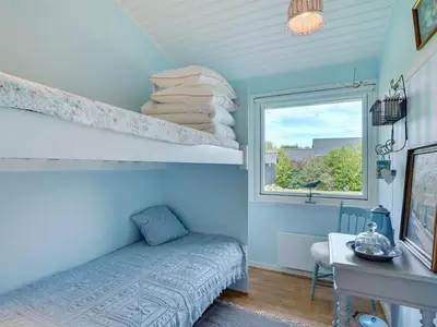 a bedroom with a bed and a window at Holiday Home Suoma - 400m to the fjord by Interhome in Roslev