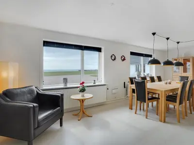 a dining room with a table and chairs at Holiday Home Imilie - 250m to the fjord by Interhome in Redsted