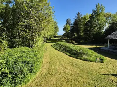 a dirt road in a field with trees at Holiday Home Aswarth - 50m to the fjord by Interhome in Fur