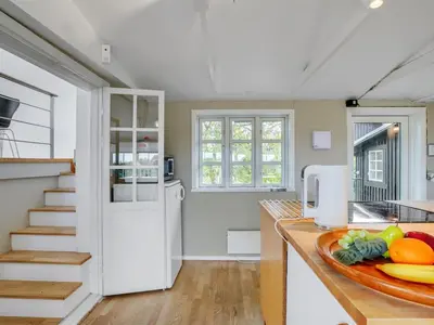 a kitchen with a counter with a plate of fruit on the counter at Holiday Home Gren - 90m to the fjord by Interhome in Roslev
