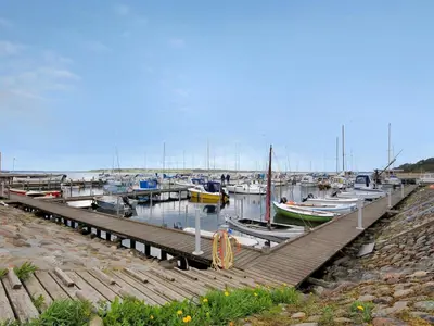 a bunch of boats are docked at a dock at Holiday Home Imgert - 300m to the fjord by Interhome in Løgstrup