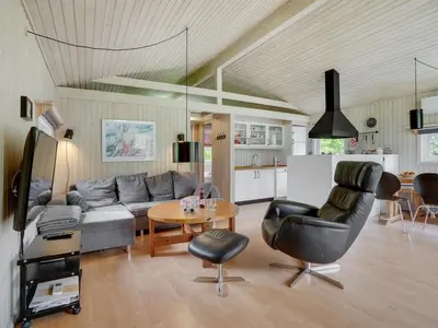 a living room with a couch and a table at Holiday Home Evan - 1-3km from the sea by Interhome in Pandrup