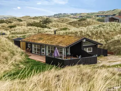 a house on a boardwalk in the dunes at Holiday Home Nielsigne - 400m from the sea by Interhome in Blokhus