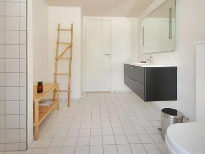 a bathroom with a sink and a ladder in it at Holiday Home Melinda - 2km from the sea by Interhome in Pandrup